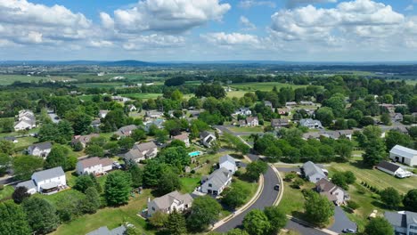 high aerial shot of american neighborhood on summer afternoon