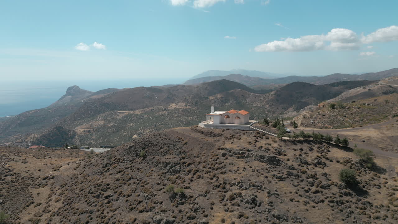 Tiny Greek Orthodox Church On Mountain Southern Crete Drone Track Back 4K 60FPS