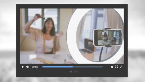 Animación-De-La-Pantalla-De-Las-Redes-Sociales-Sobre-Una-Mujer-Caucásica-Haciendo-Un-Video-Blog-En-Casa