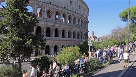 tourists visiting the colosseum in rome, italy