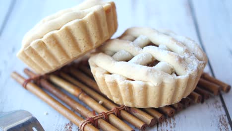 mini apple pies on a wooden surface