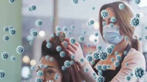 Animation-of-coronavirus-cells-over-caucasian-female-hairdresser-and-woman-wearing-face-mask