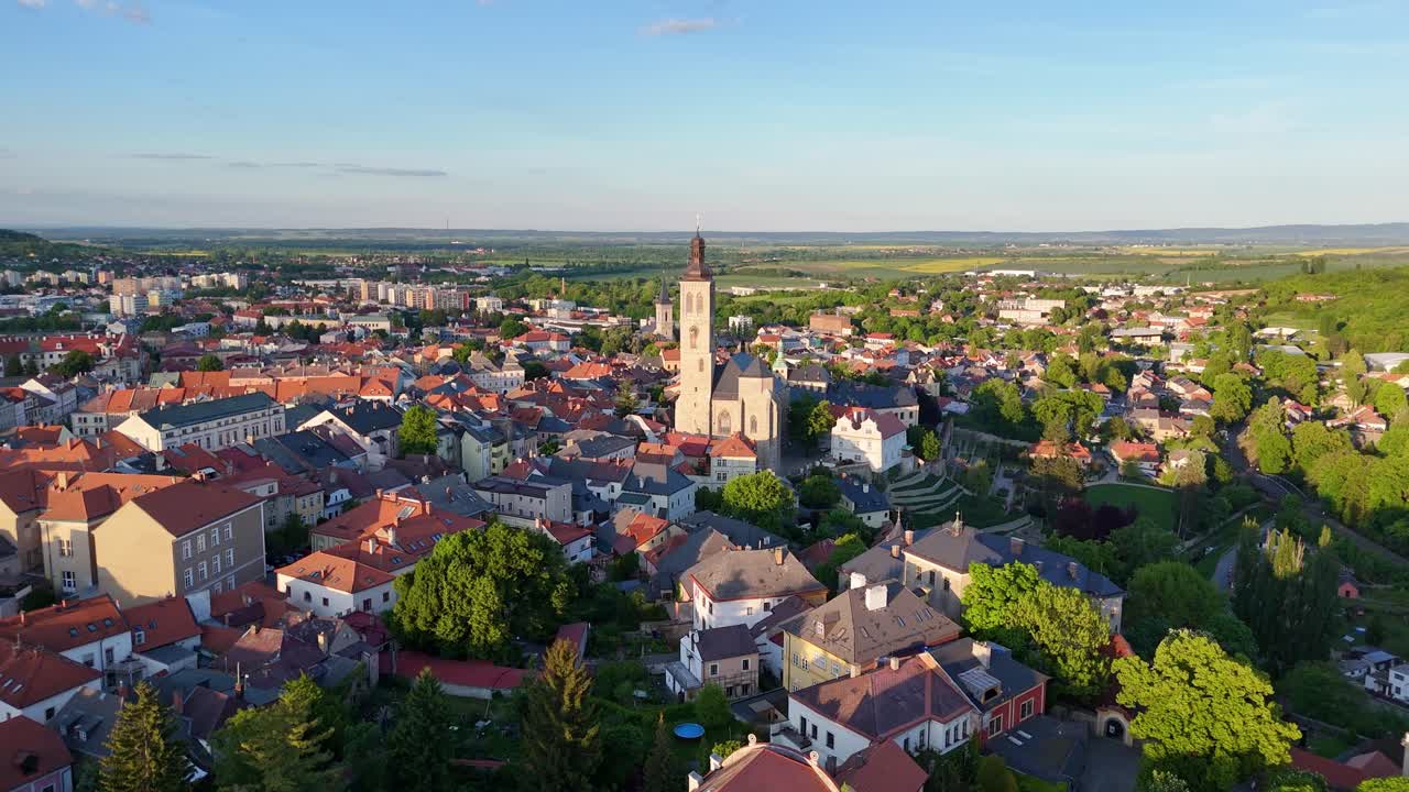 Drone view of Kutna Hora old town with Church of St. James standing tall above city blocks