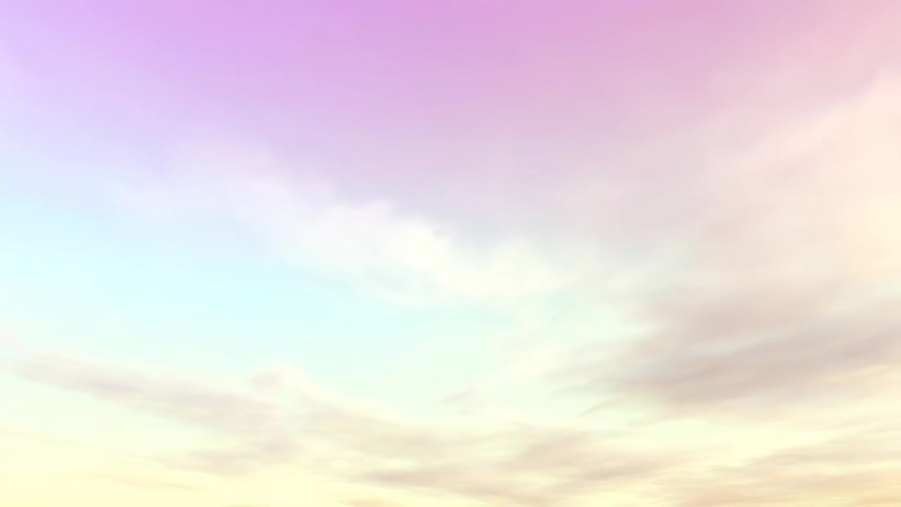 Pastel Colored Clouds Drifting Across a Soft Sky