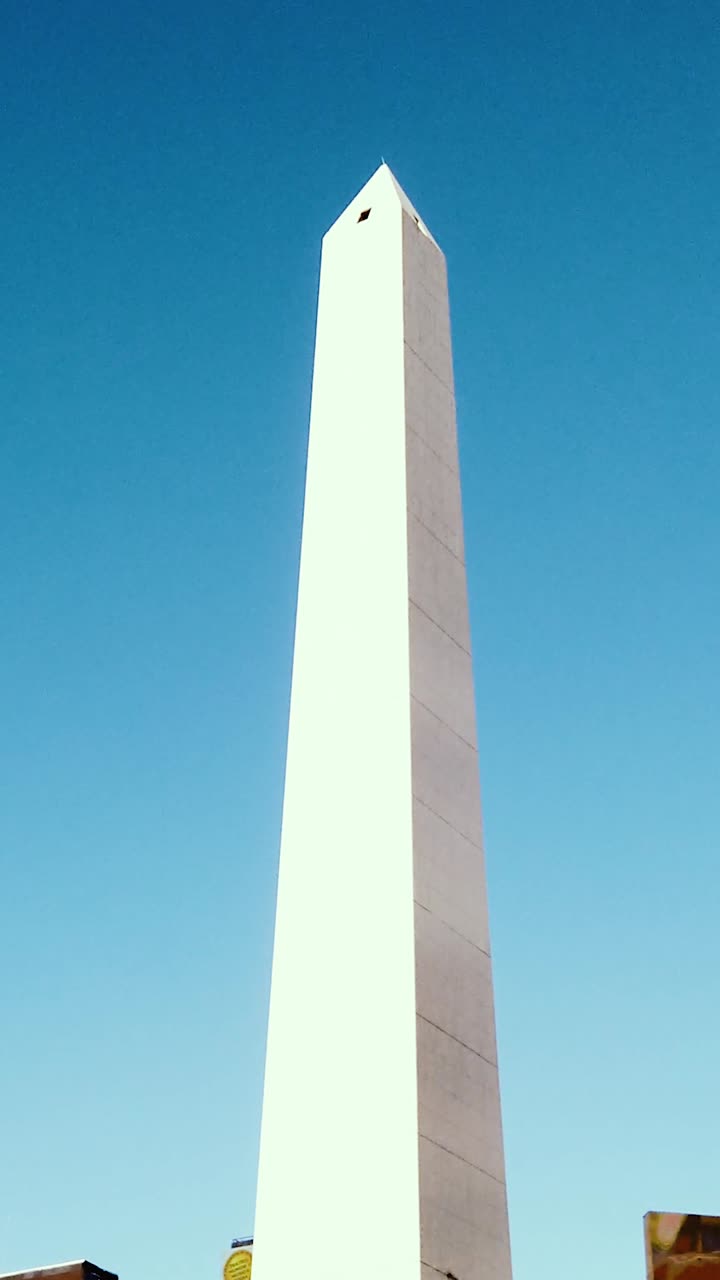 Low angle view of Obelisk monument in Buenos Aires Argentina with blue sky