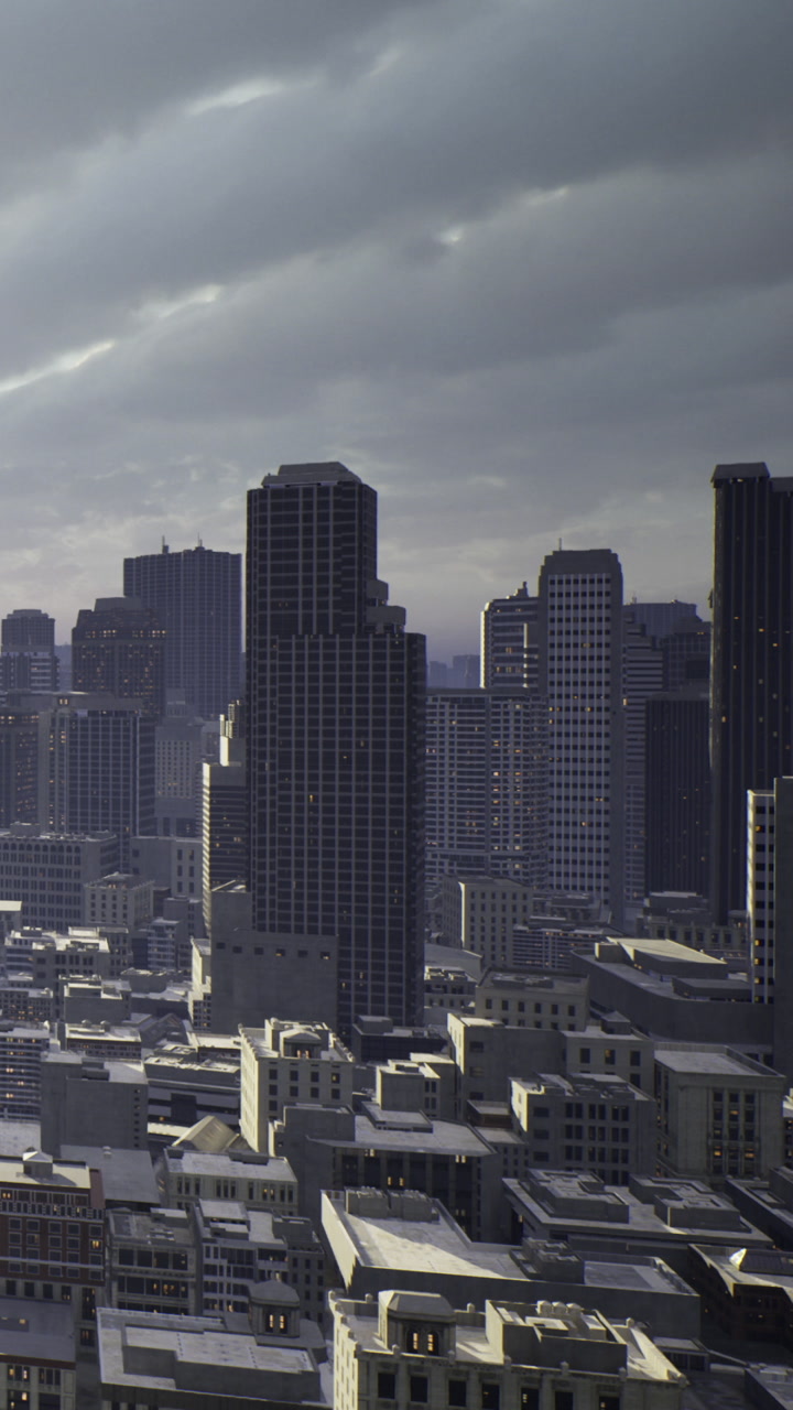 City skyline with buildings under cloudy sky during late afternoon