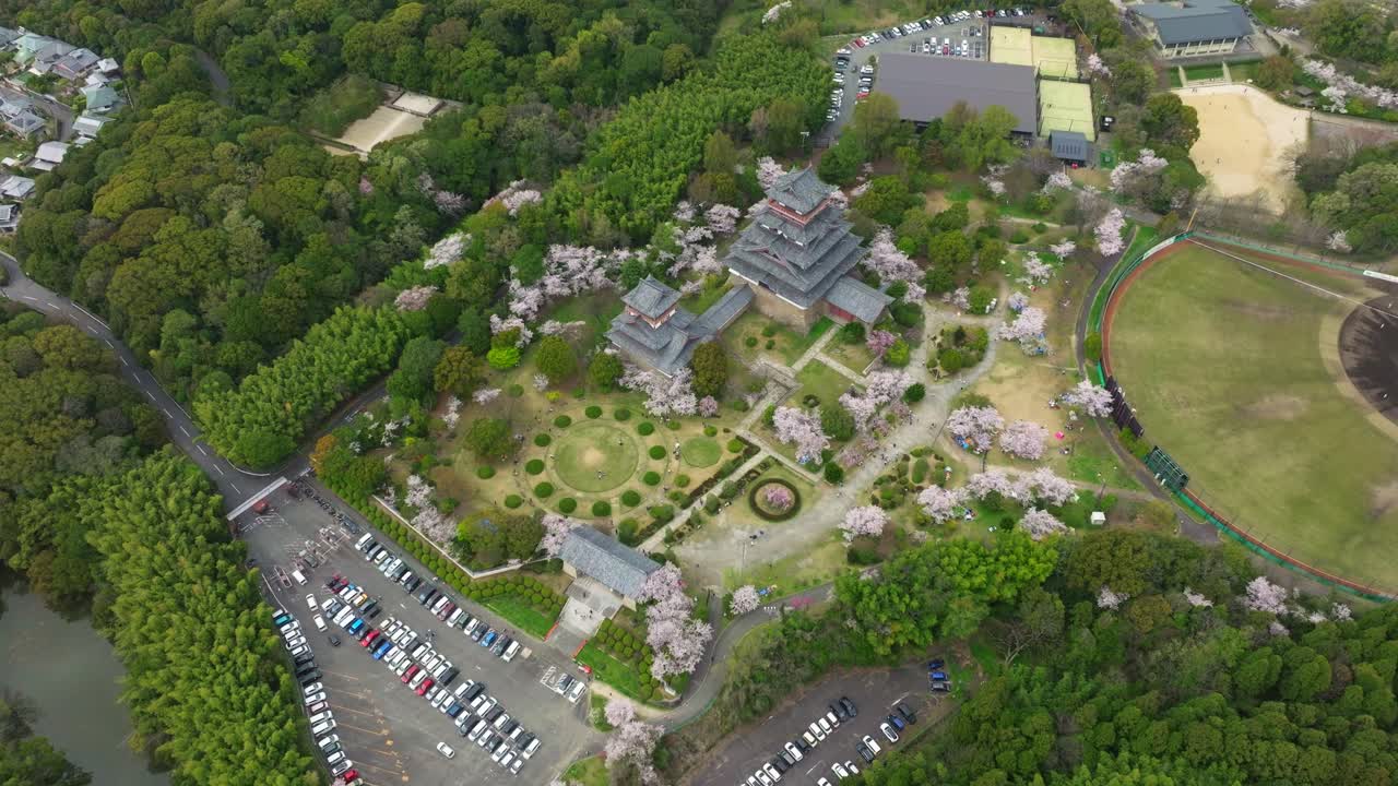Japan aerial landscape, top down in Fushimi Castle Temple with Pink sakura cherry blossom flowers