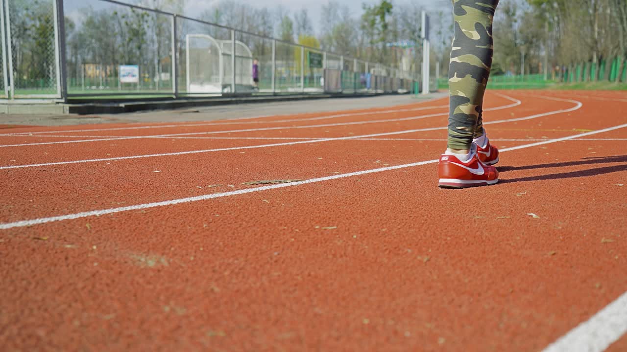 athletic pair of legs going for a jog - healthy lifestyle concept