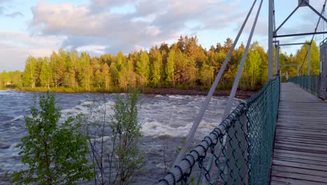 Suspension-bridge-on-Glomma-River-in-the-forest-in-Hedmark-county-in-Norway