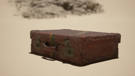 vintage suitcase abandoned in the desert