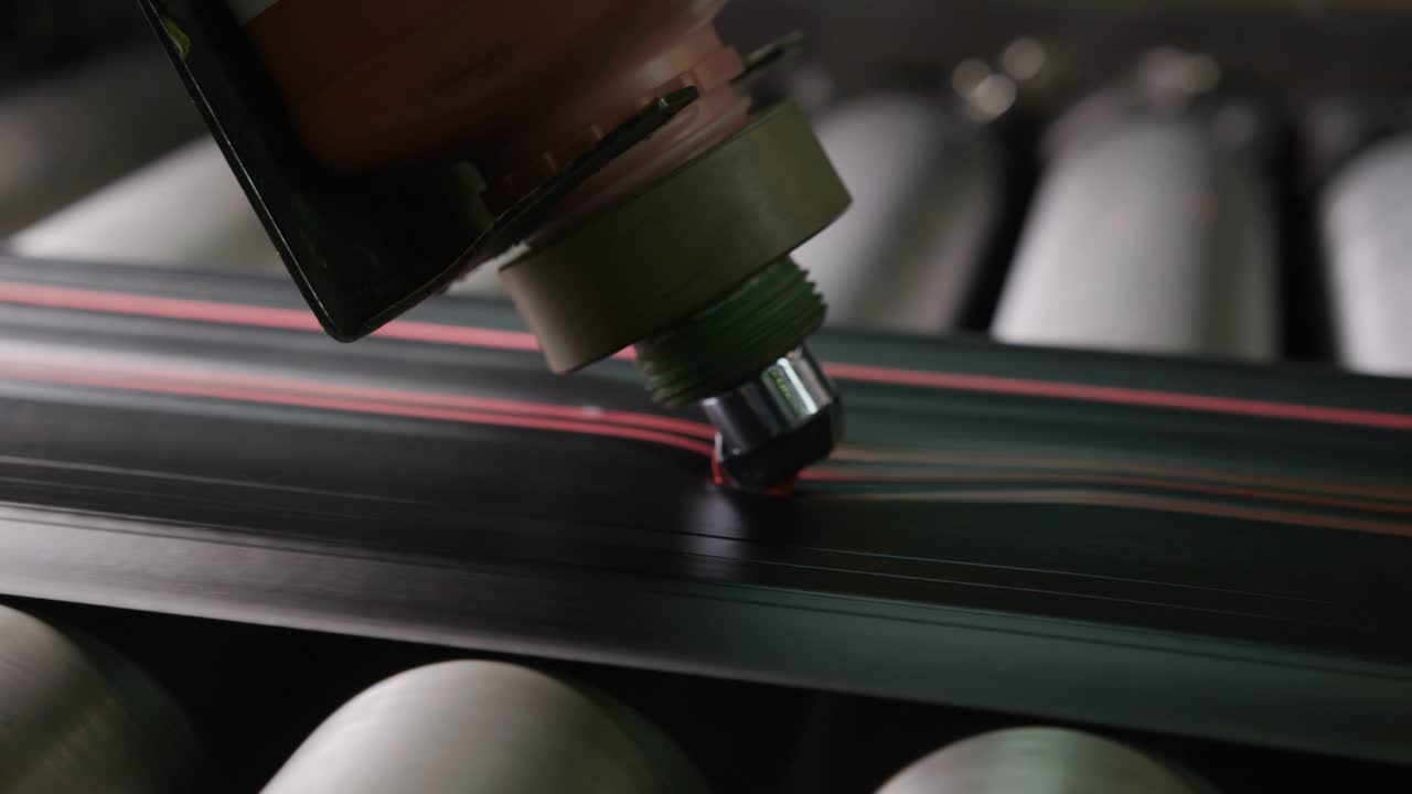 Gun Makes Red Mark Lines on Rubber Tire Protector Macro