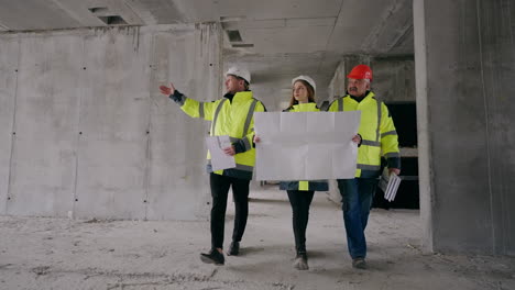 civil engineers are viewing under-construction building woman architect and foremen