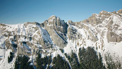 snowy summit and cliff of diablerets mountain massif near solalex and anzeinde in vaud, switzerland