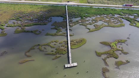 grand isle drone view of a long dock on the gulf of mexico