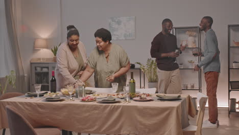 friends and family enjoying a dinner party together