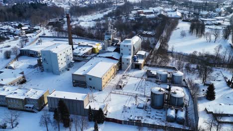 drone view industrial building of electric utility company in city of silute in winters, lithuania