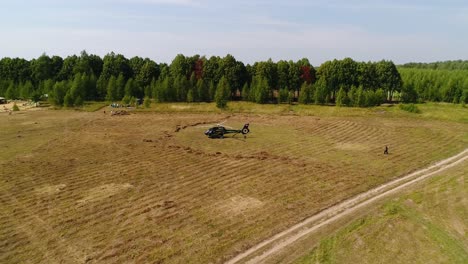 helicopter landing in a field