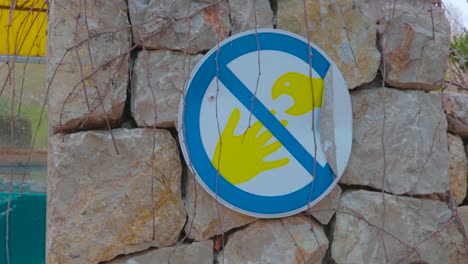 a view of a sign not to touch sea animals at palma aquarium, mallorca, spain