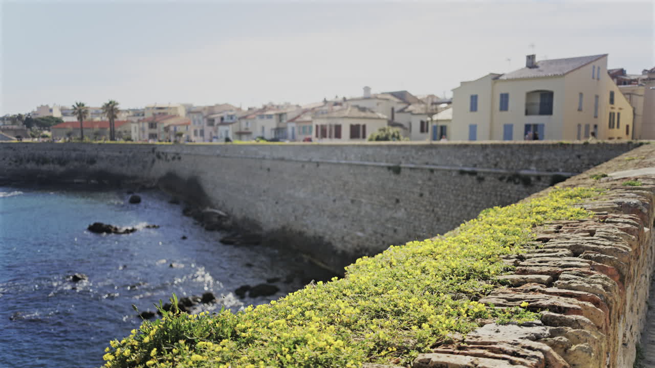 Blurred view of the sea and the city from the coast