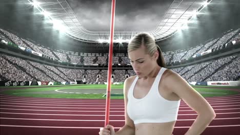 female athlete standing with javelin throw