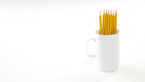 yellow color pencils kept in mug