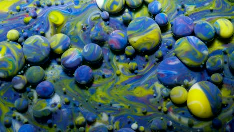 Slow Motion Bright Colors Bubbles Oil Beautiful Paint Universe Color Moving Multicolored Close Up. Acrylic Paint. Fantastic Hypnotic Surface. Abstract Colorful Paint Metamorphosis Structure Bubbles