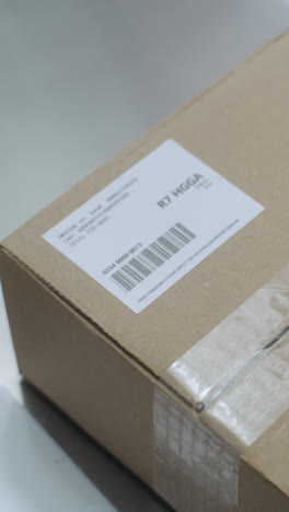 packaging a box with label and tape