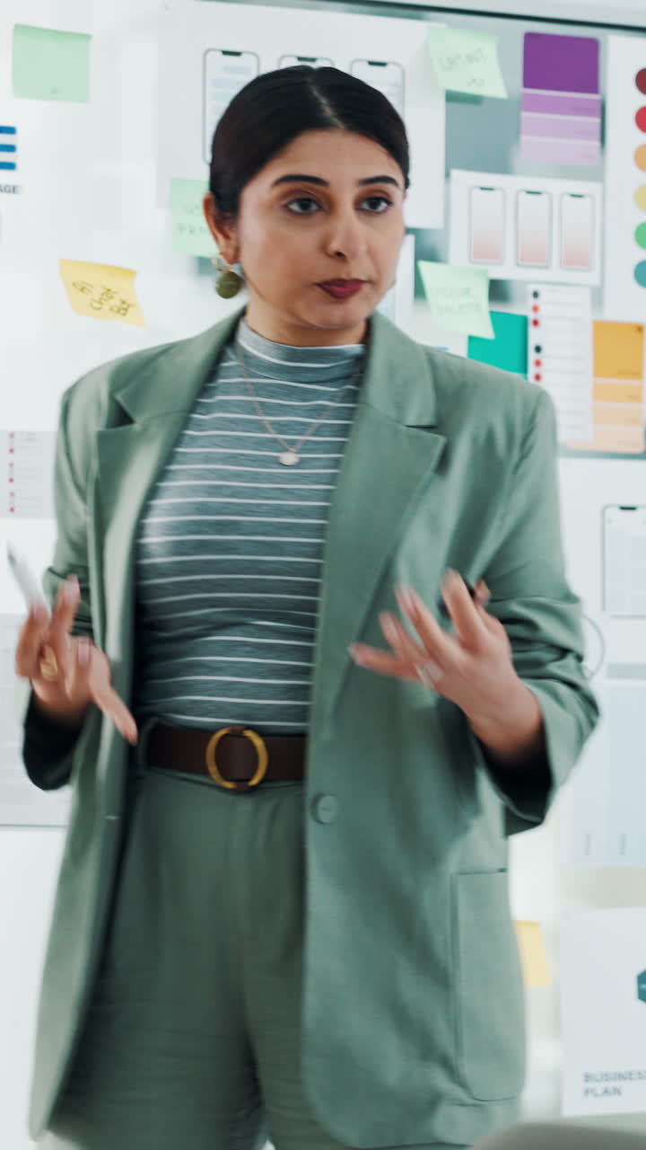 Young Woman Presenting Business Strategy on Whiteboard