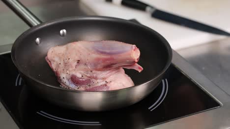 raw lamb shoulder in pan