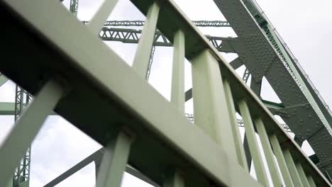 looking up at industrial steel bridge strong low angle girder beam support framework dolly right