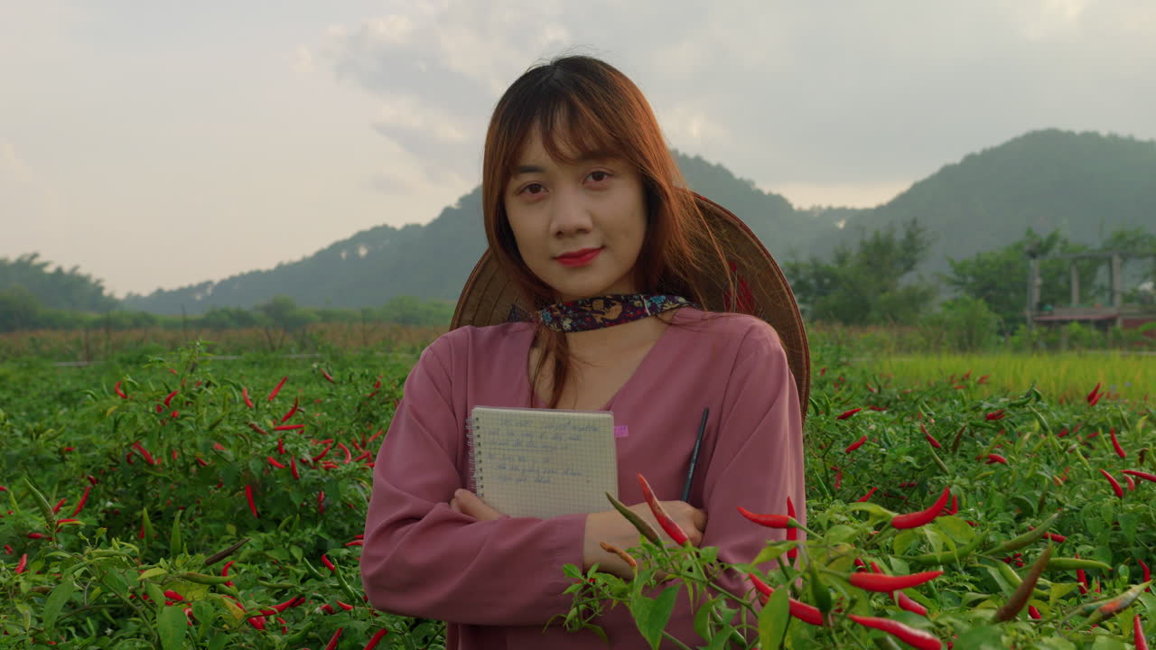 Woman farmer in chili pepper field