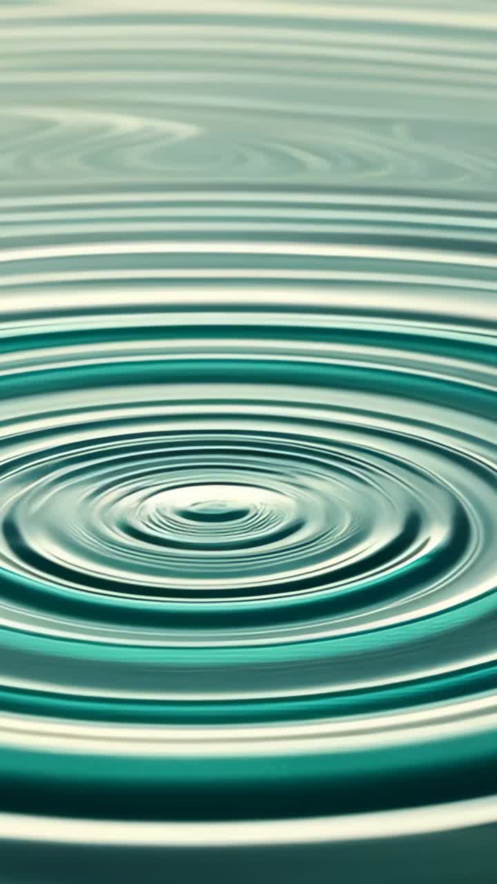 Vertical video: Striking droplet gently initiating concentric ripples expanding in water tank