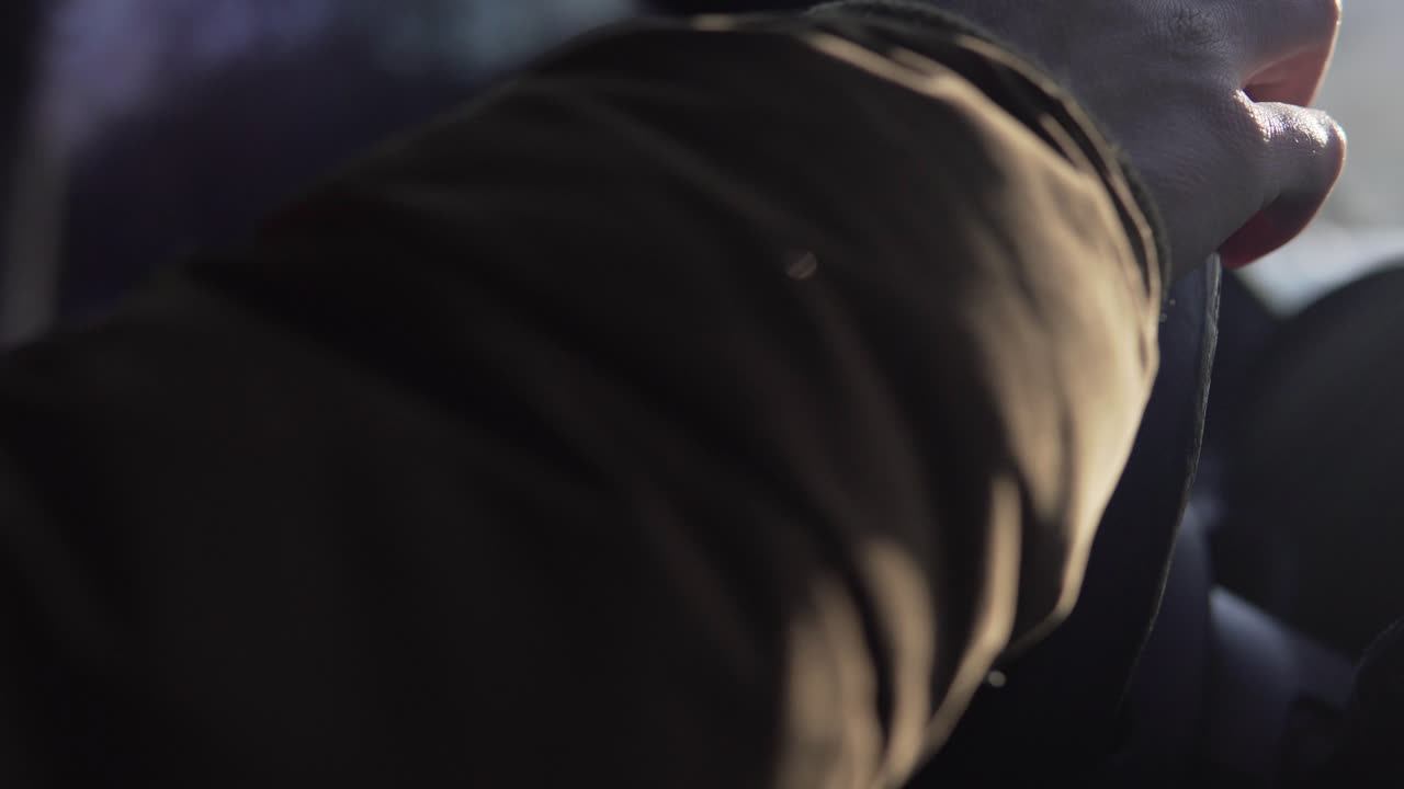Hands of a man driving a car in 4k