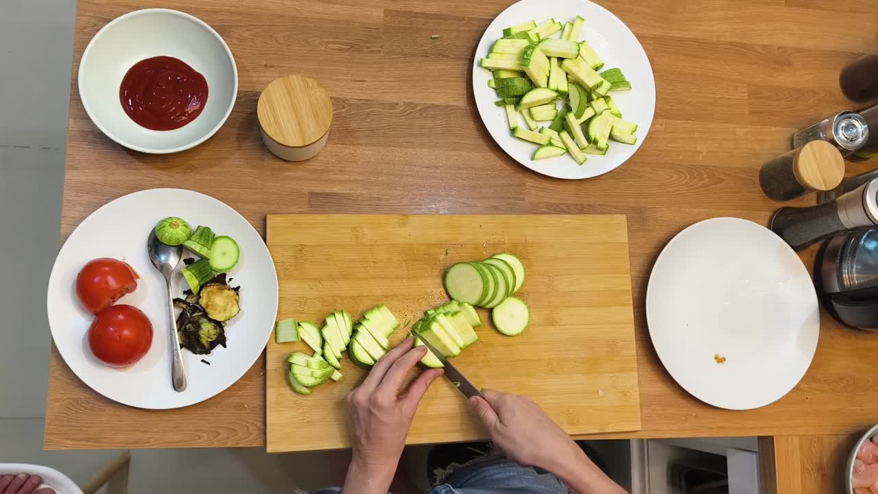 Preparing zucchini on a wooden board