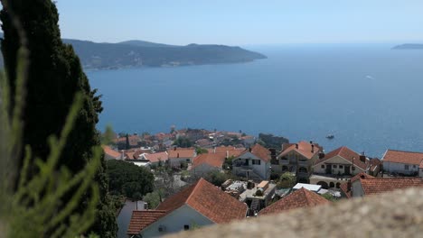 seaside village, houses with red roofs, coastline, adriatic sea, montenegro