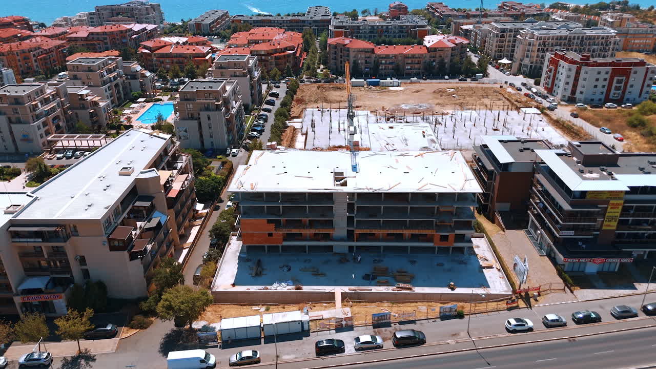 Varna, Bulgaria, 11 July 2025: Coastal construction progress seen. New building development is underway by the coast, showing construction activity and urban surroundings during daylight