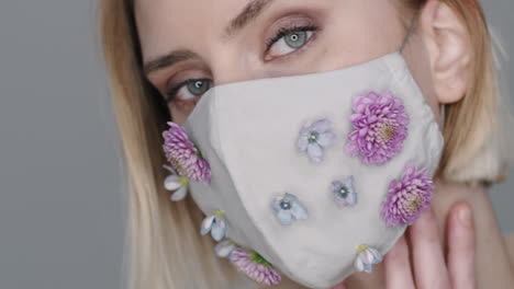 close up of sensual woman in face mask with flowers