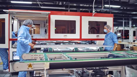 workers inside modern factory background. production of new details in technologically advanced factory. modern industries.