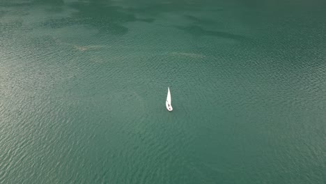 calm relaxing scene of yacht sailing in serene sunset of switzerland