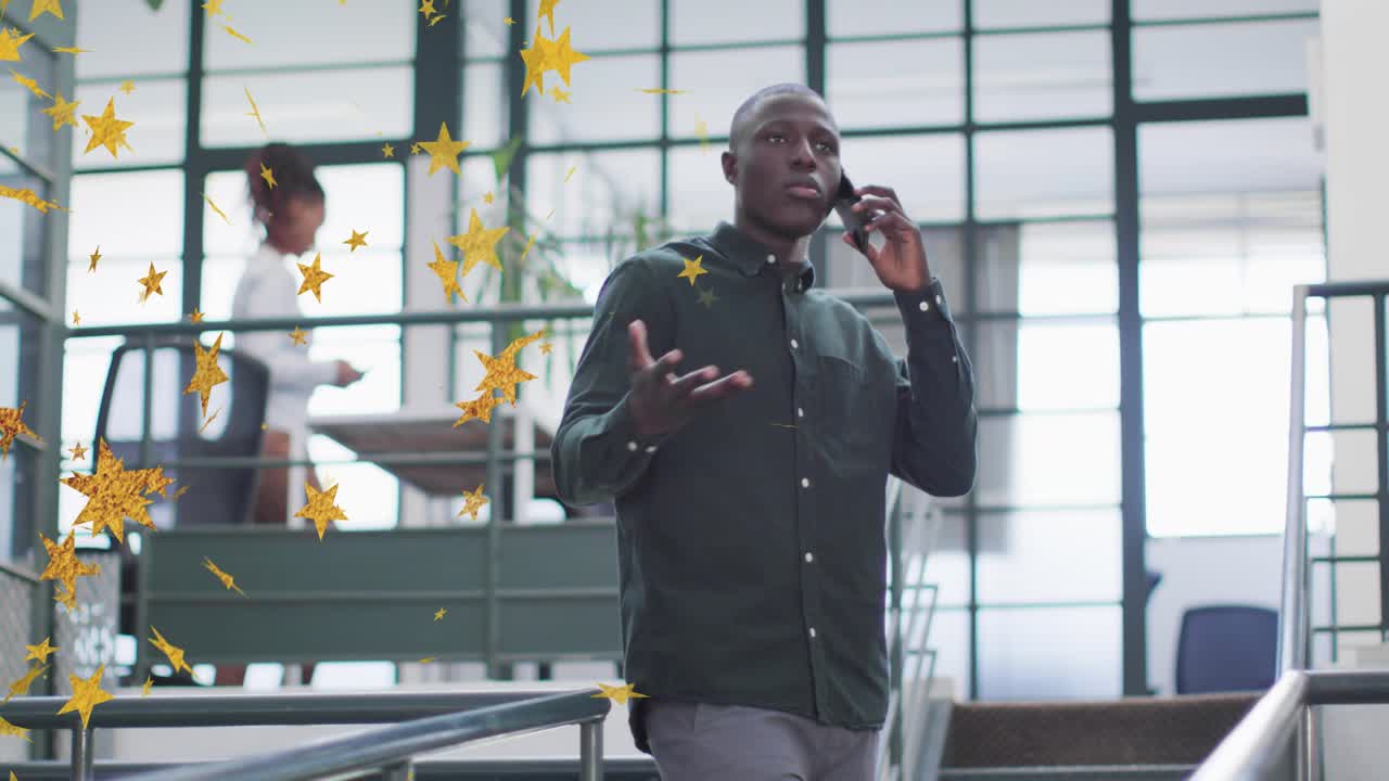 Corporate pro taking smartphone call and descending office stairs gesturing, golden star drifting