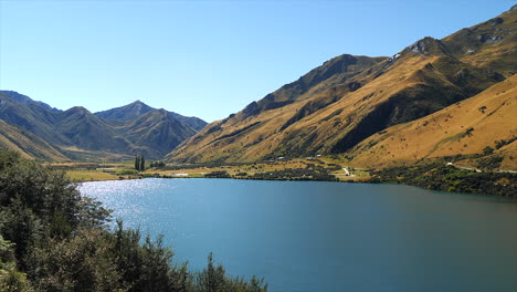 panning scenic view of moke lake near queenstown, new zealand