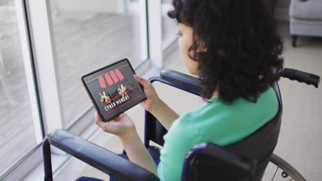 Biracial-woman-in-wheelchair-using-tablet,-online-shopping-during-cyber-monday-sale,-slow-motion