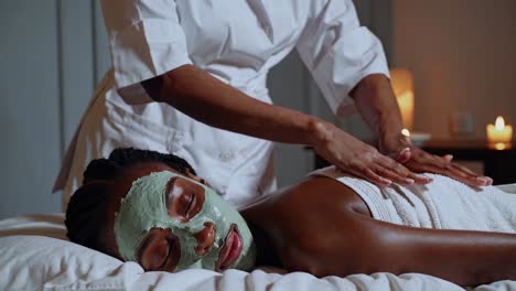 woman receiving facial treatment at spa