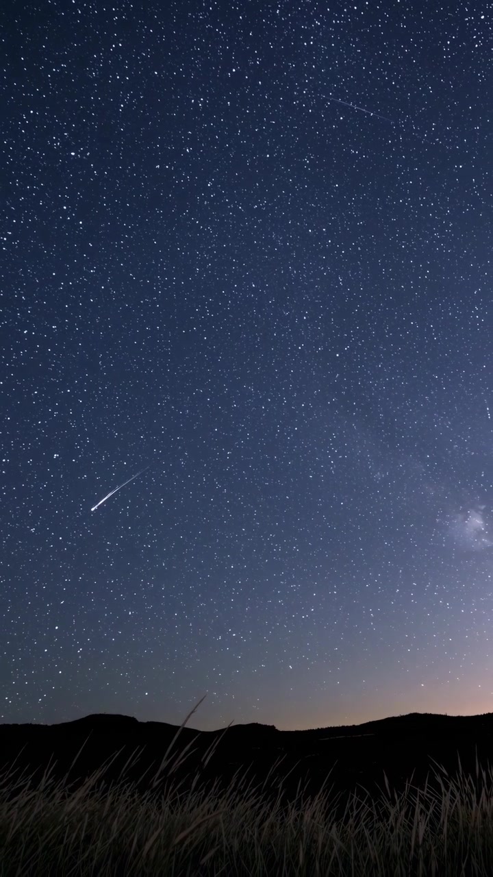 Time Lapse of a Shooting Star in a Starry Night Landscape