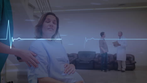 animación del ritmo cardíaco sobre diversas trabajadoras de la salud que llevan a una mujer embarazada en silla de ruedas