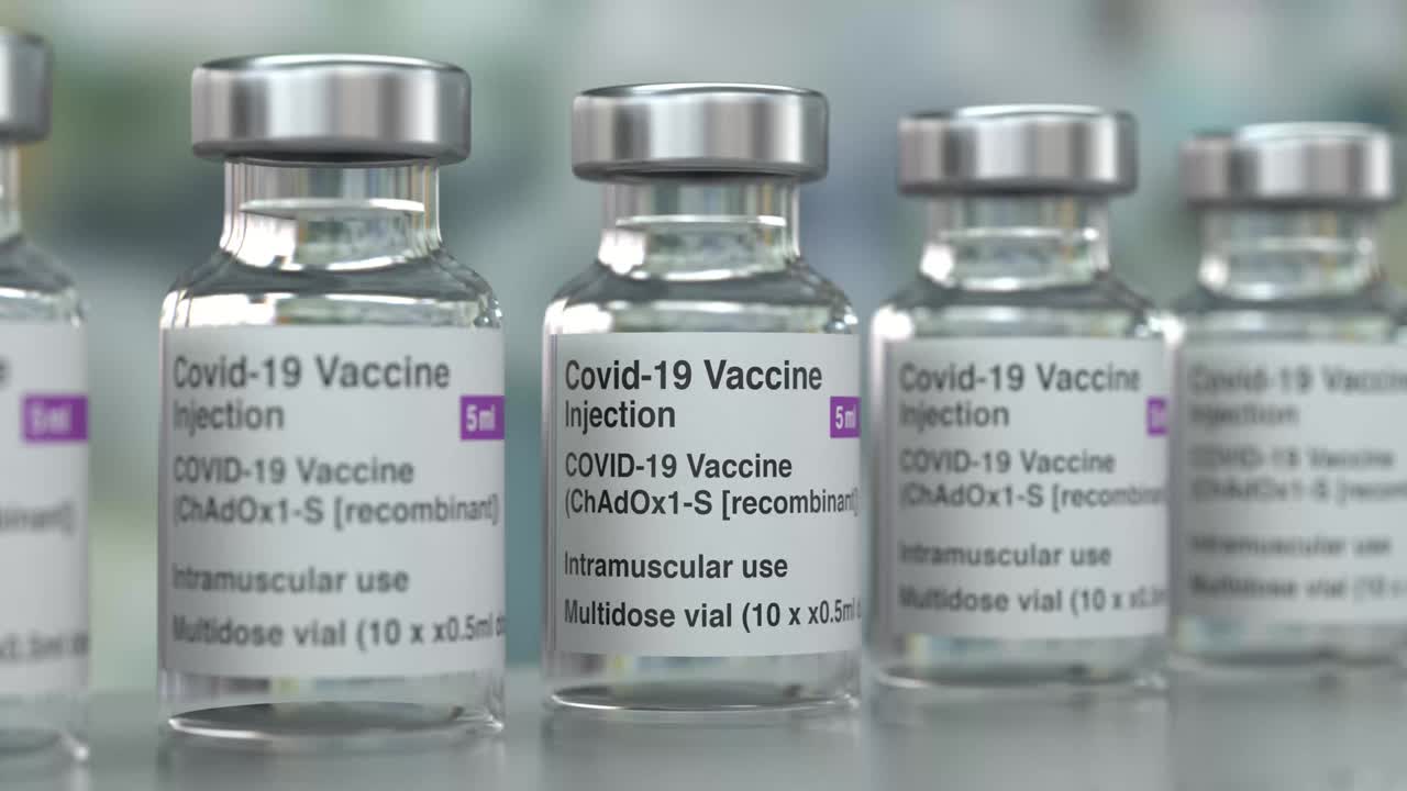 los viales de la vacuna contra el virus de la corona son un bucle de fábrica en 4k.