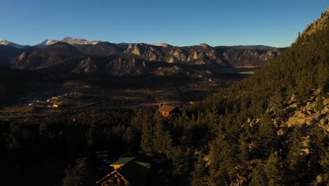 mountain valley home on cliff sunset aerial shot 4k