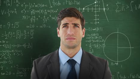 Man-in-front-of-moving-maths-on-blackboard