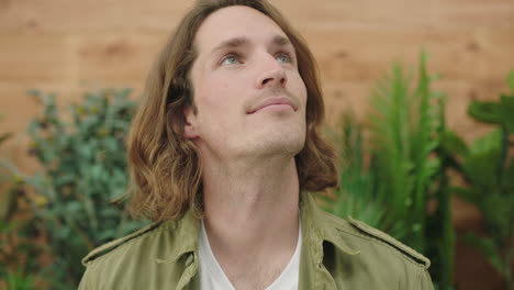 close up portrait of young pensive caucasian man thinking looking up