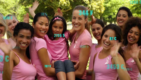 Group-of-women-in-pink-shirts-celebrating-with-numbers-animation-over-them